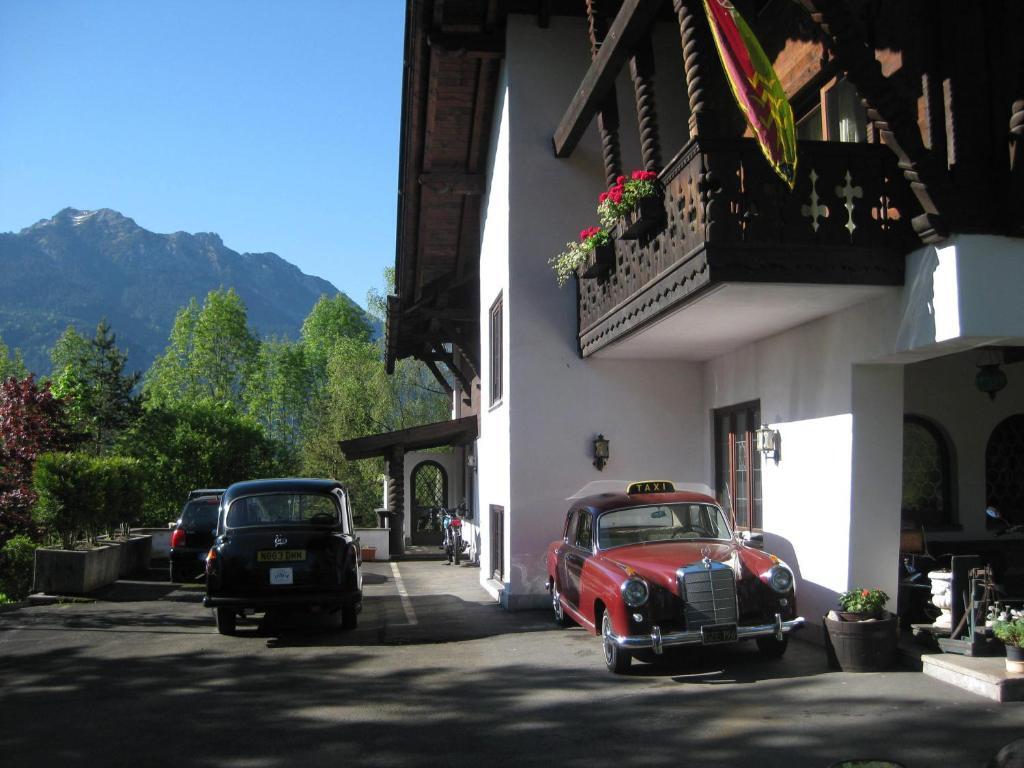 Traditional Bavarian entrance at Panoramahotel Karwendelhof with mountain view